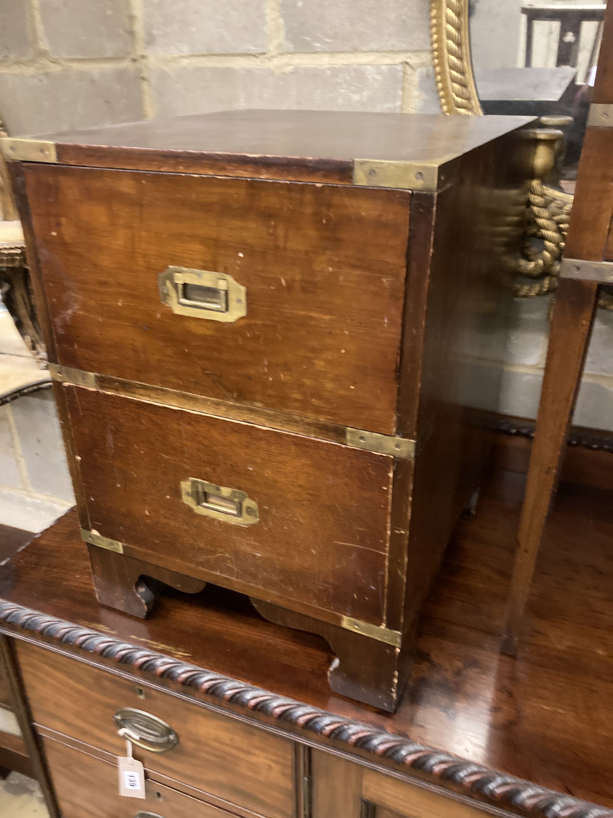 Three military style mahogany two drawer bedside chests, larger width 40cm, depth 46cm, height 56cm